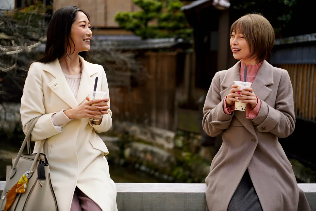 front view young women with bubble tea compressed